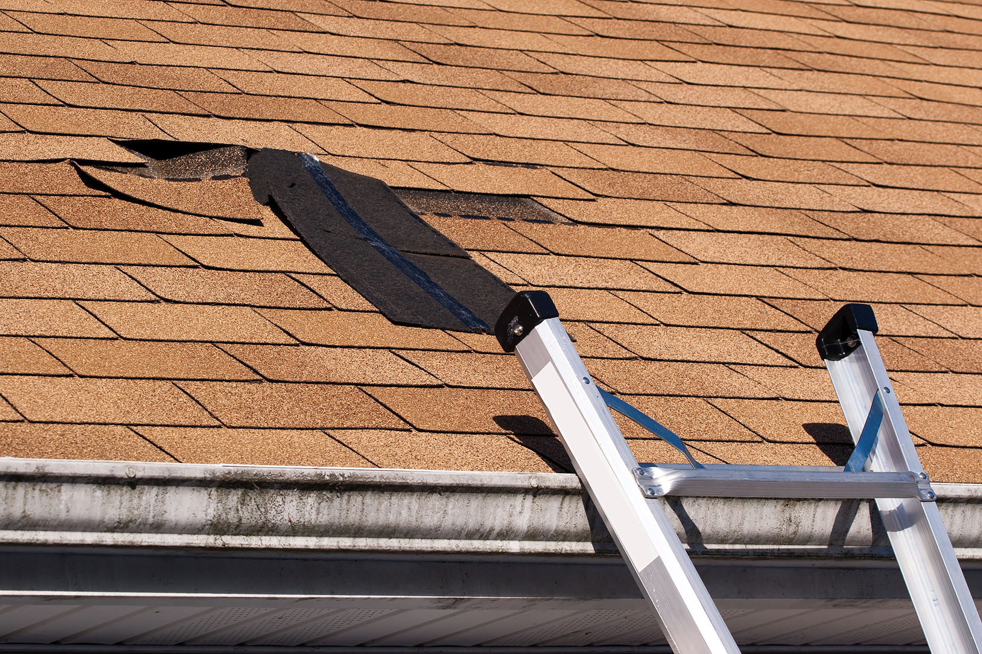 Roof leak specialist tracing a leak source on a Coachella Valley tile roof