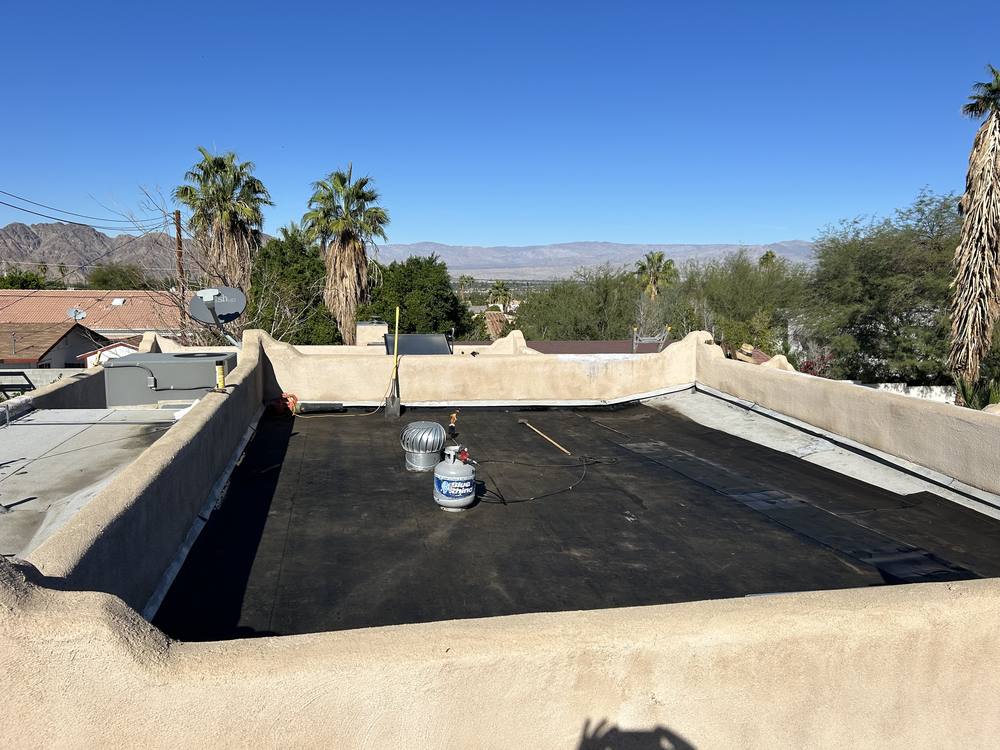 New cap sheet installed inside the parapet walls of a desert flat roof