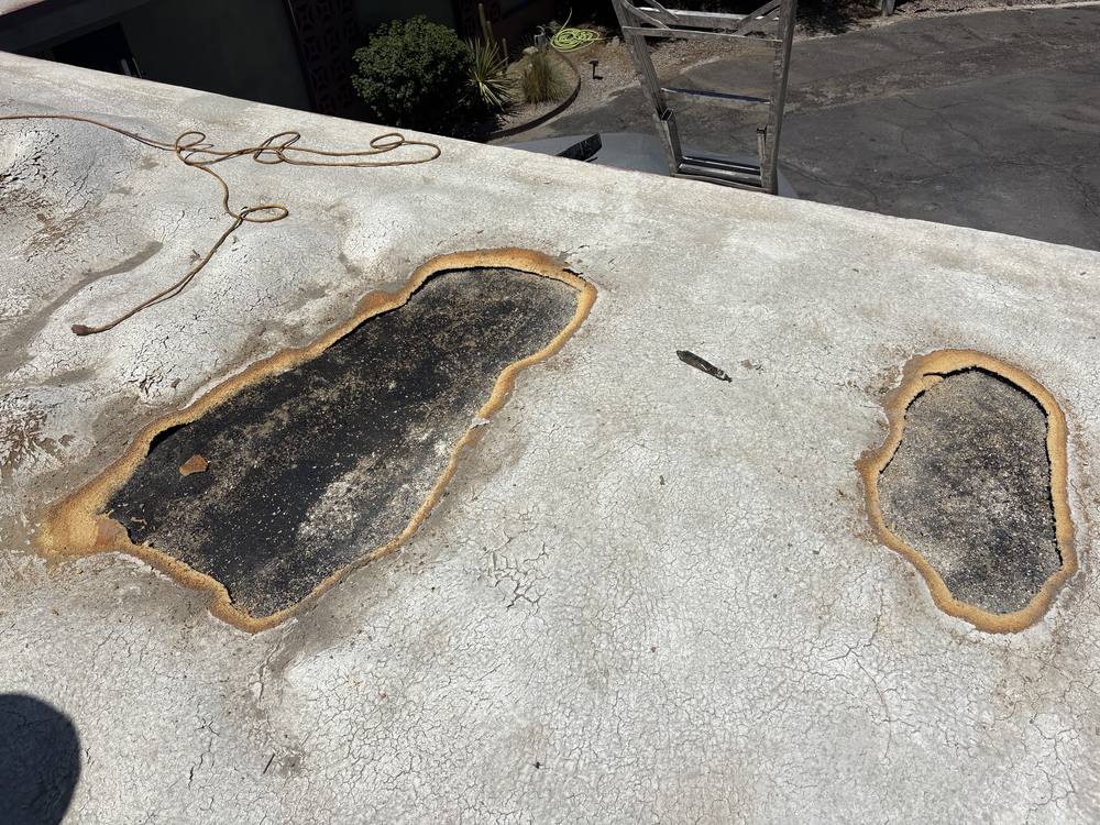 Blistered foam roof opened up for repair